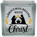 Glass block with a Christmas design featuring silhouettes of a nativity scene and text.