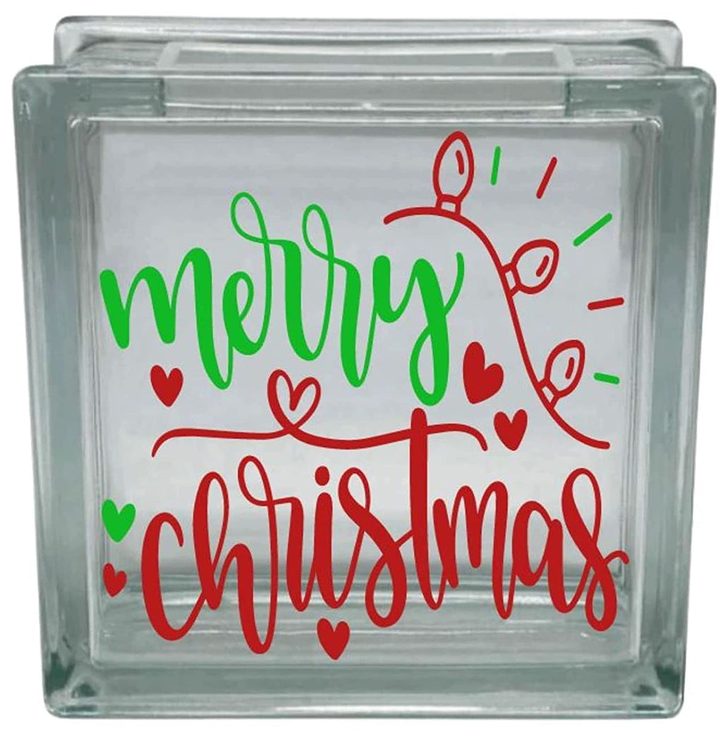 Glass block with 'Merry Christmas' text and decorative elements on a white background