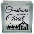 Glass block with Christmas design featuring nativity scene and text 'Christmas Begins with Christ'.