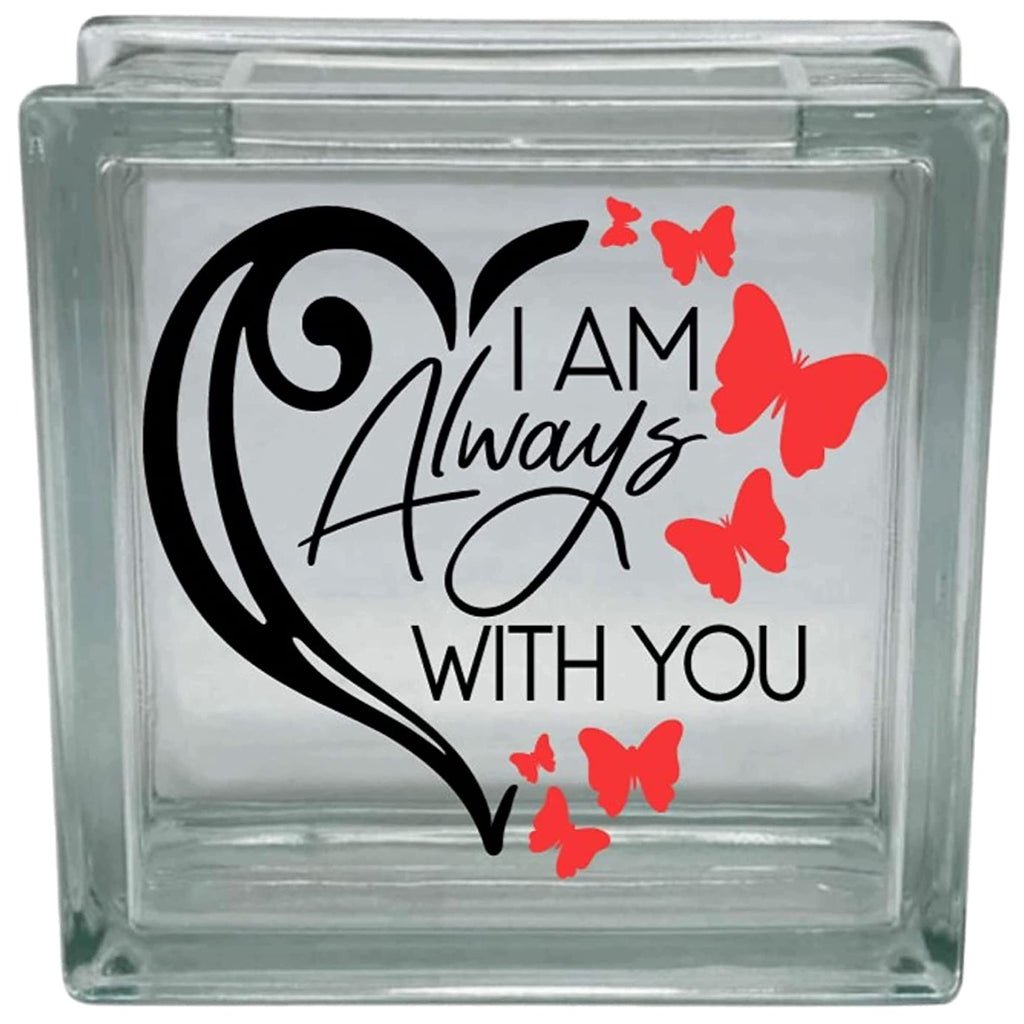 Glass block with decorative text and red butterflies on a white background