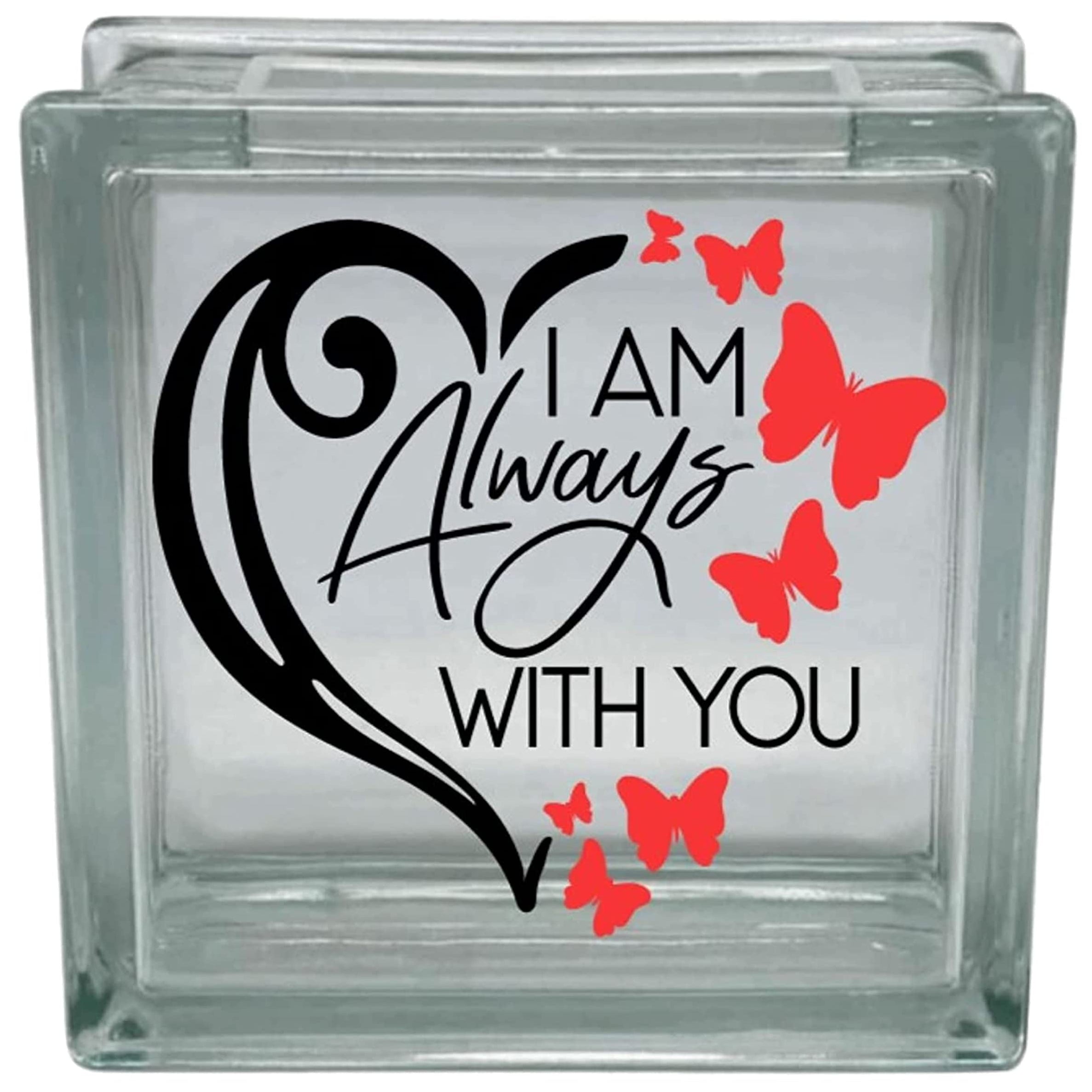 Glass block with decorative text and red butterflies on a white background