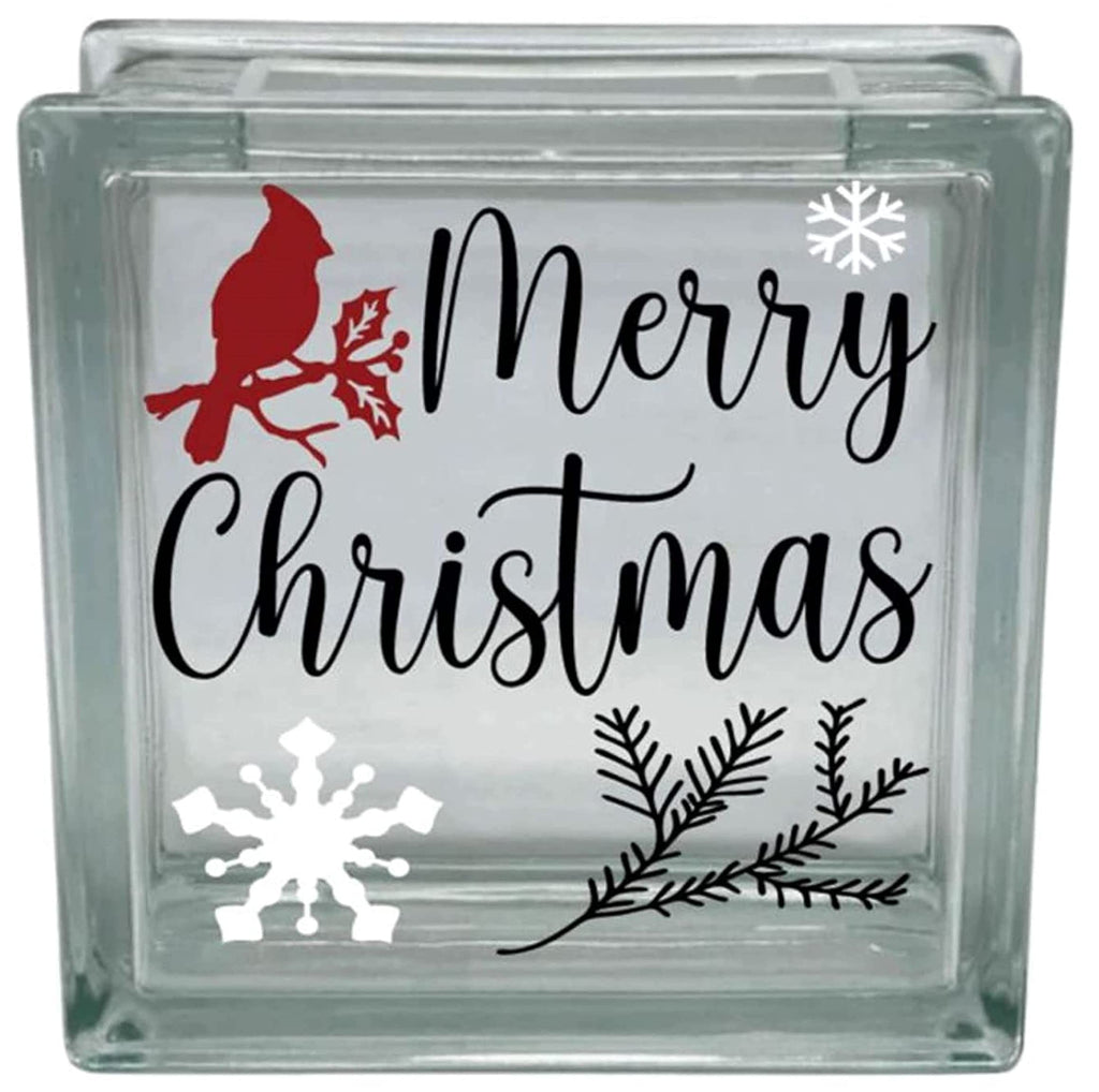 Glass block with Christmas design featuring a cardinal, snowflakes, and foliage.