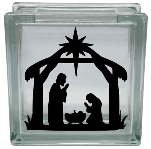 Glass block with a black nativity scene silhouette